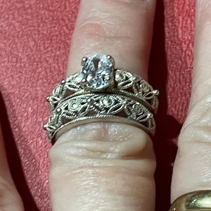 Sterling silver with A Stone that has a slight blue tint it’s a two piece Set